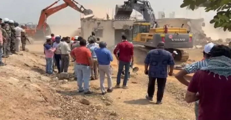 Bulldozers action on former minister house 